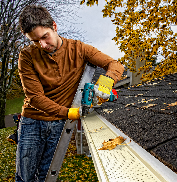 contractor installing gutter guard protection
